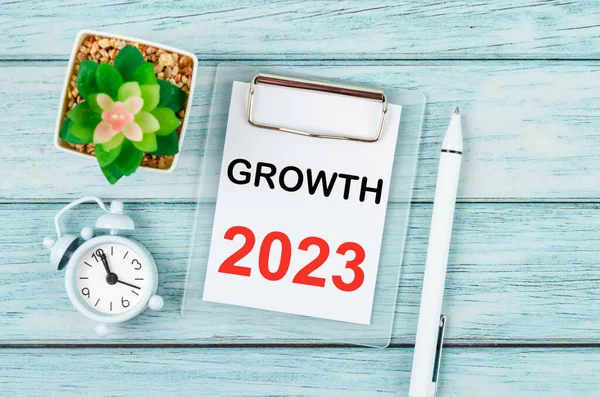 2023 Growth : Goal and Target Setting List for 2023 year with alarm clock. Change and determination concept.