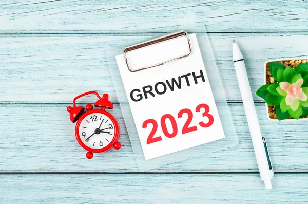 2023 Growth : Goal and Target Setting List for 2023 year with alarm clock. Change and determination concept.