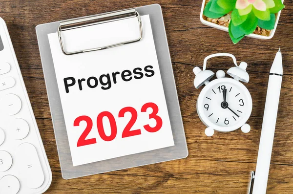 Progress 2023 Setting List for 2023 year with alarm clock. Change and determination concept.
