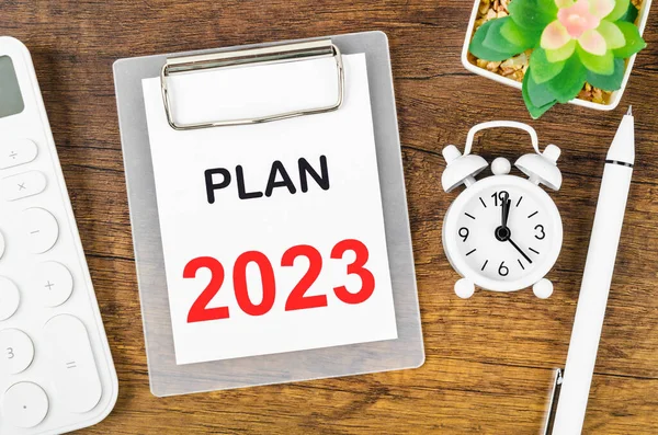 PLAN 2023, Goal and Target Setting List for 2023 year with alarm clock. Change and determination concept.