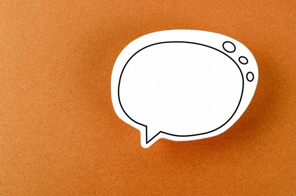 Speech bubble with copy space communication talking speaking concepts on orange colour background.