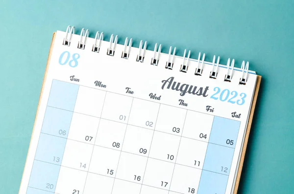 August 2023 calendar desk for the organizer to plan and reminder isolated on blue background.