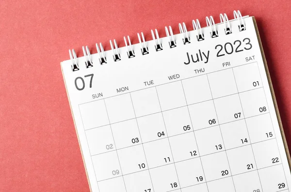 July 2023 calendar desk for the organizer to plan and reminder isolated on red background.