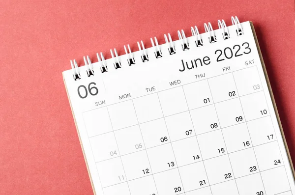 June 2023 calendar desk for the organizer to plan and reminder isolated on red background.