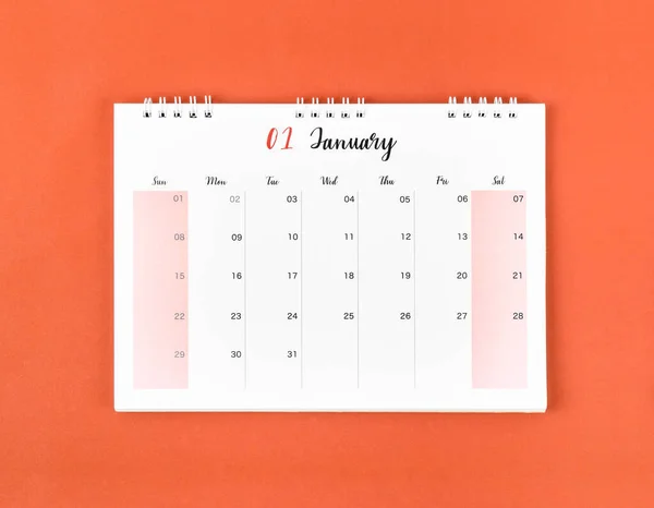 January 2023 calendar desk for the organizer to plan and reminder on red background.