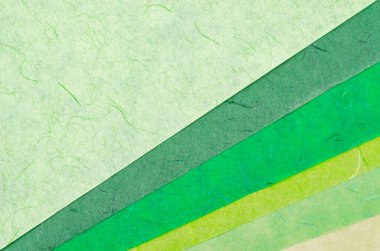 Geri dönüştürülmüş kağıttan yapılan yeşil kağıt dokusunun renk dokusu tasarımcılar tarafından bir proje için doğru renkleri tanımlamak için kullanılır.