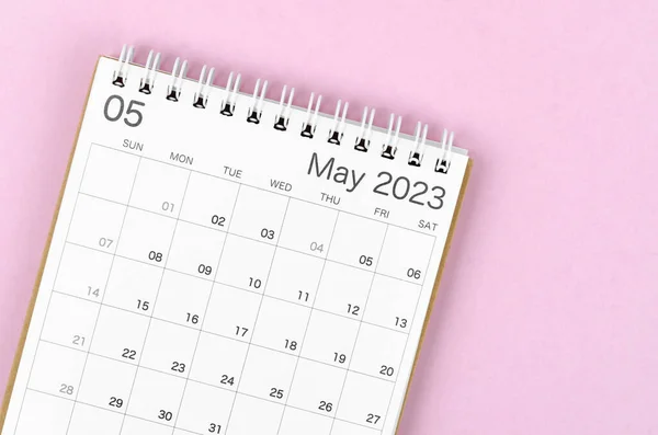 May 2023 calendar desk for the organizer to plan and reminder isolated on pink background.
