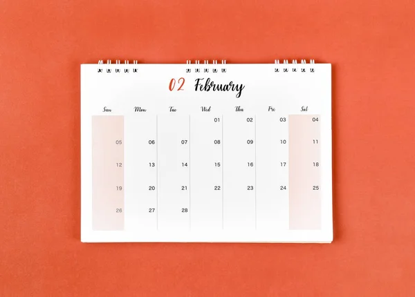February 2023 calendar desk for the organizer to plan and reminder on red background.