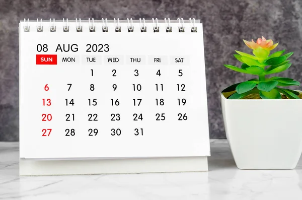 stock image August 2023 Monthly desk calendar for 2023 year with plant pot.