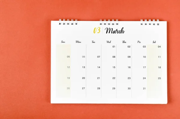 March 2023 calendar desk for the organizer to plan and reminder on red background.