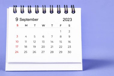 September 2023 Monthly desk calendar for 2023 year on purple background.