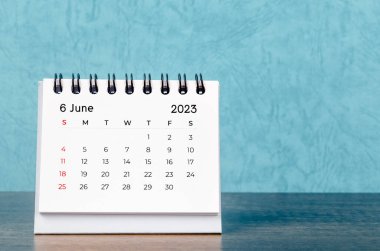June 2023 desk calendar on blue color background, Vintage style.