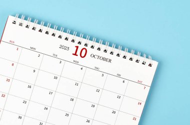 October 2023 Monthly desk calendar for 2023 year on blue background.
