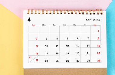 April 2023 Monthly desk calendar for 2023 year on beautiful background.