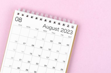 The August 2023 calendar desk for the organizer to plan and reminder isolated on pink background.