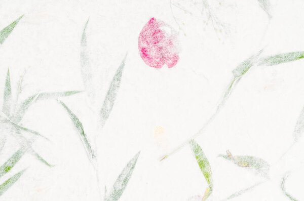 Handmade recycled flower and leaf paper background.