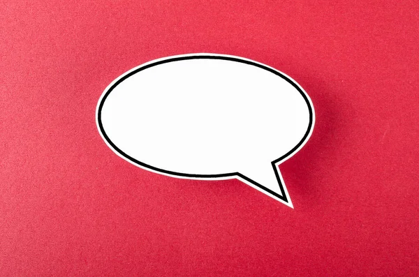 Speech bubble with copy space communication talking speaking concepts on red background.