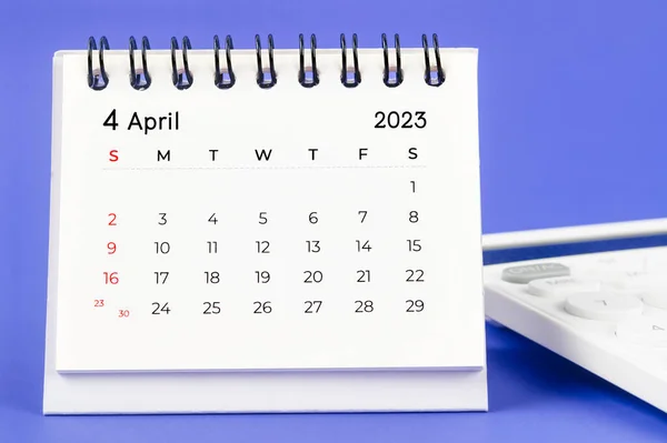 April 2023 Monthly Desk Calendar 2023 Year Calculator Purple Background — стоковое фото