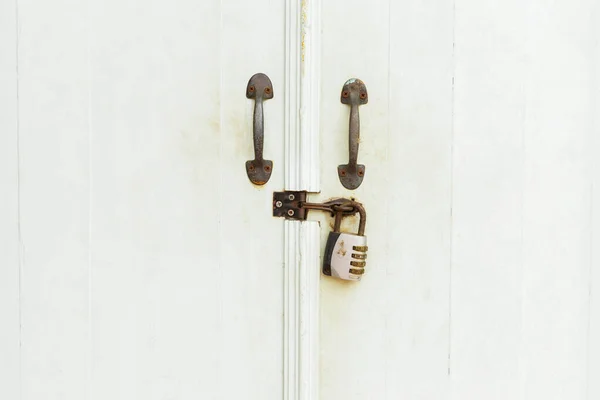 Closed Padlock Hangs White Doors — Zdjęcie stockowe