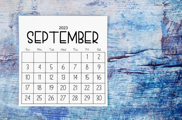 stock image September 2023 Monthly calendar for 2023 year on old blue wooden background.