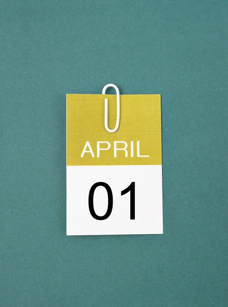 April 1St Calendar Sheet Paper Clip Dark Green Background — Stock Photo, Image