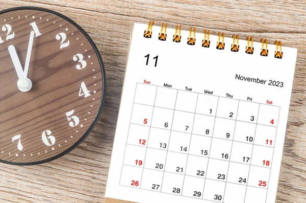 stock image November 2023 Monthly desk calendar for 2023 year with clock.