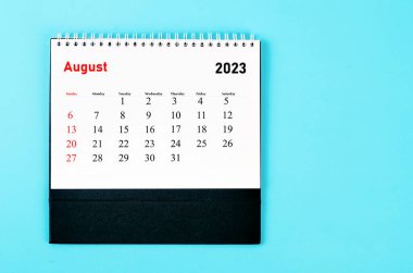 August 2023 Monthly desk calendar for 2023 year on blue background.