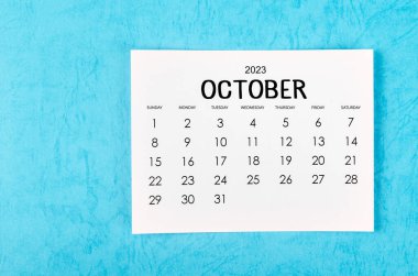 Mavi arka planda 2023 yılı için Ekim 2023 aylık takvim.