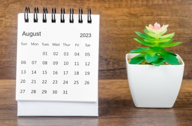 August 2023 Monthly desk calendar for 2023 year with plant pot.
