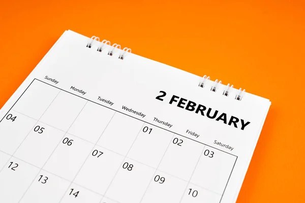 February 2024 month calendar on orange color cover background. Monthly calendar concepts.