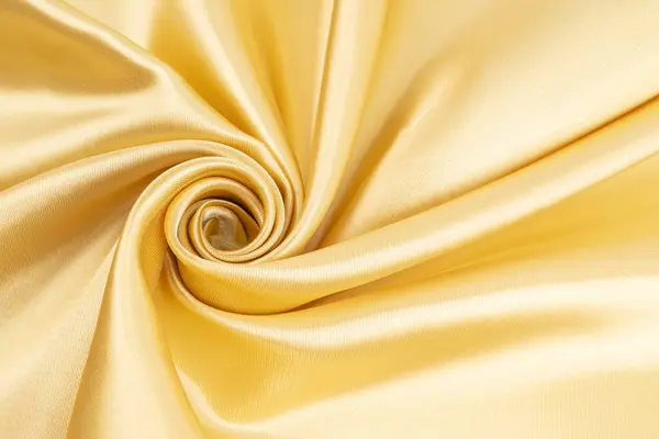 Close-up shot of gold satin texture backgrounds
