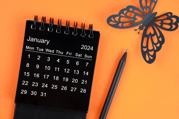 2024年1月台历 主办单位计划 提醒及彩色纸的橙色背景 — 图库照片