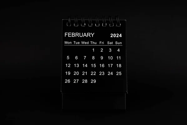 Black Calendar for February 2024. Desktop calendar on a black color background.