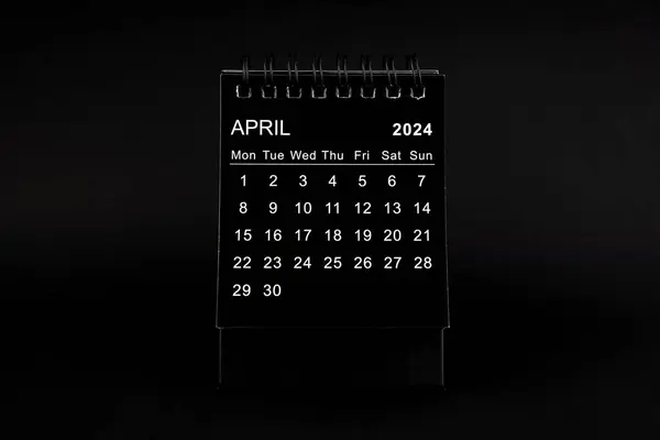 Black Calendar for April 2024. Desktop calendar on a black color background.