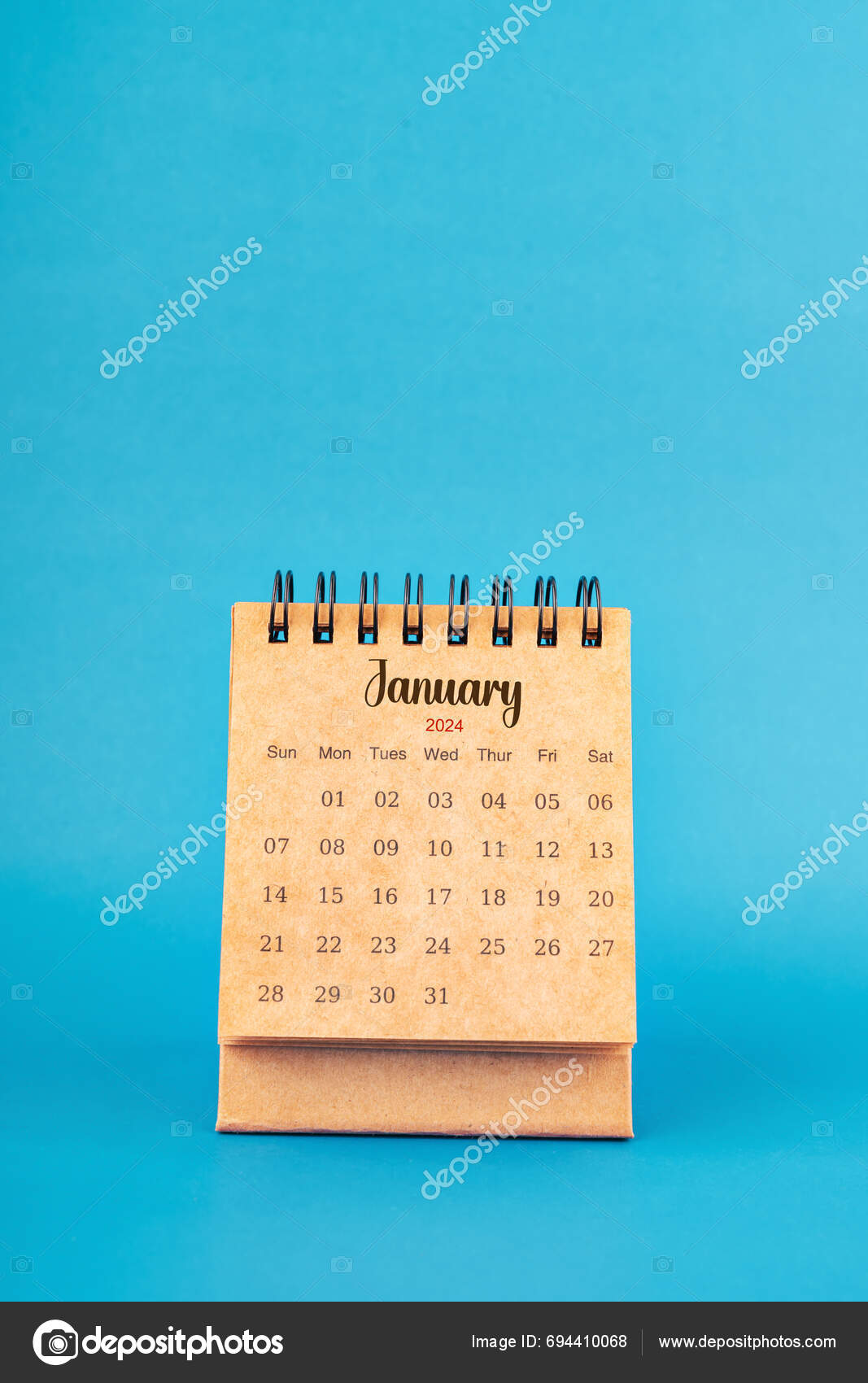 January 2024 White Desk Calendar Blue Color Background Stock Photo