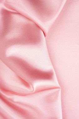 Lüks kumaşın soyut arkaplanı pembe renk ipeği desenli.