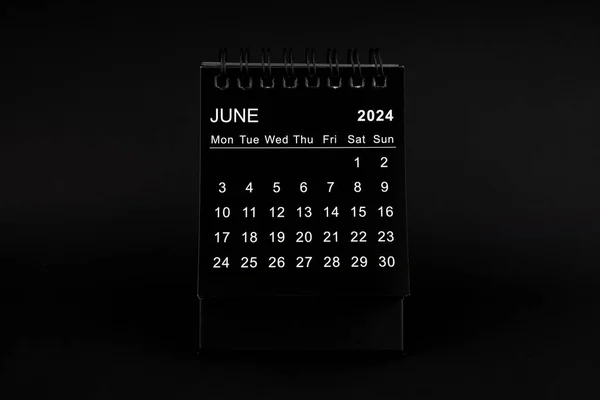 Black Calendar for June 2024 . Desktop calendar on a black color background.
