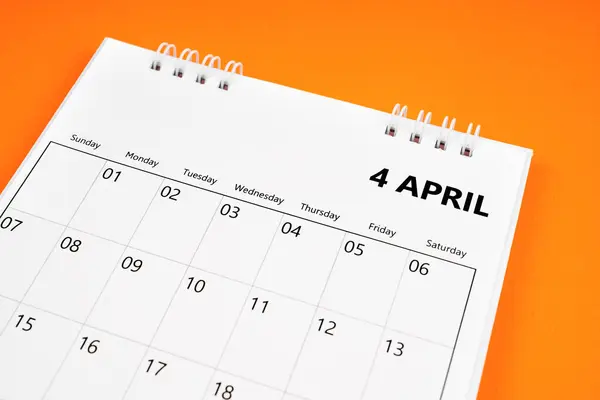 April 2024 month calendar on orange color cover background. Monthly calendar concepts.