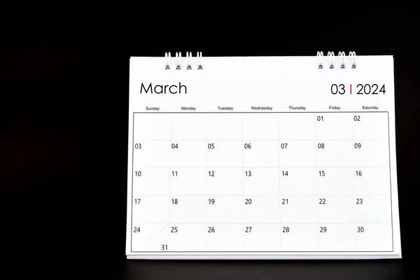 Desk Calendar for March 2024. Desktop calendar on a black color background.