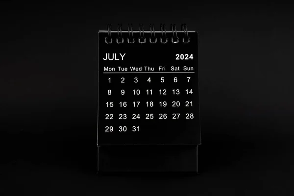 Black Calendar for July 2024. Desktop calendar on a black color background.