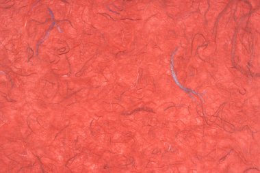 Arkaplan olarak kırmızı renkli dut kağıdı dokusu.