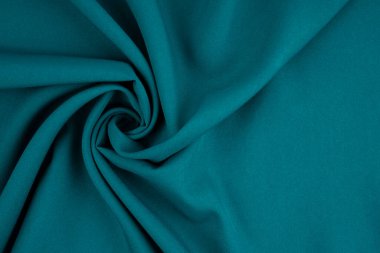 Yeşil yumuşak ipek malzeme arkaplan dalgalarını kapat.