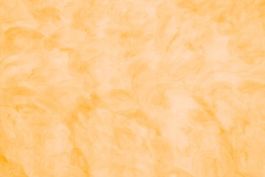 Arkaplan olarak soyut sarı renkte boyanmış duvar dokusu.