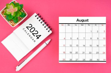 White calendar for August 2024 and pen on pink color background, planning concept. clipart
