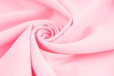arka plan olarak pembe kumaş dokusu.