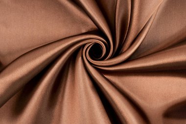 Brown background luxury cloth or wavy folds of grunge silk texture. clipart