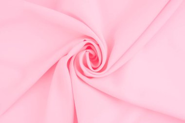 Arka plan olarak yumuşak hafif pembe yün dokunun buruşuk yüzeyi.