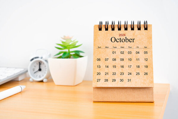 Front view of October 2024 desk calendar on worktable.