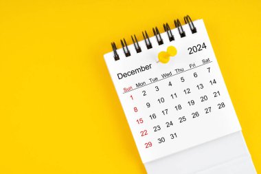 December 2024 Monthly desk calendar for 2024 year with thumbtack on yellow background. clipart