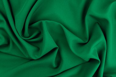 Doku, arka plan, desen. Yeşil ipek kumaş dokusu. Güzel zümrüt yeşil yumuşak ipek kumaş.